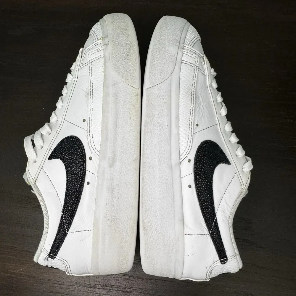 Nike White Leather Low-Top Sneakers with Black Swoosh and Yellow Tongue